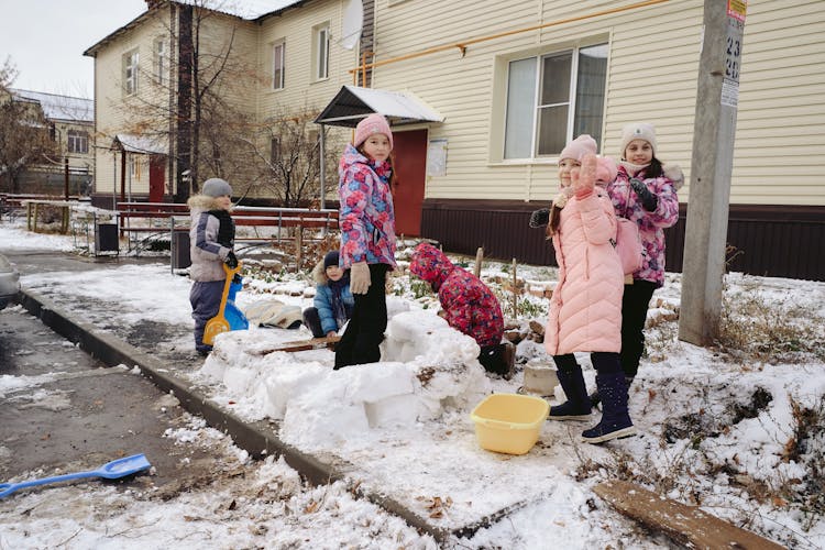 Cute Girls Playing With Snow