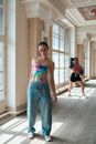 Women in a Hallway Posing