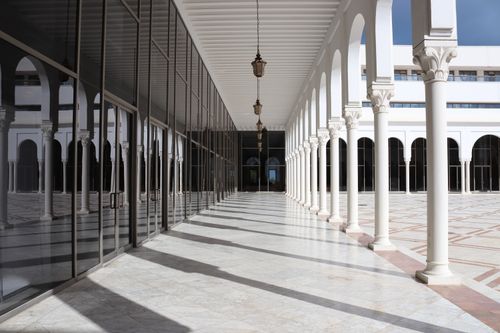 Free A stunning architectural shot with glass reflections and elegant arches in Algeria. Stock Photo