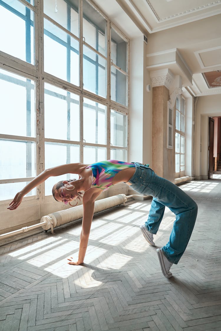 Woman Doing Dance Moves Near The Window