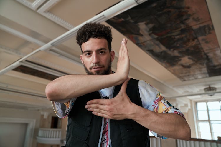 A Man Doing A Finger-Tutting Dance