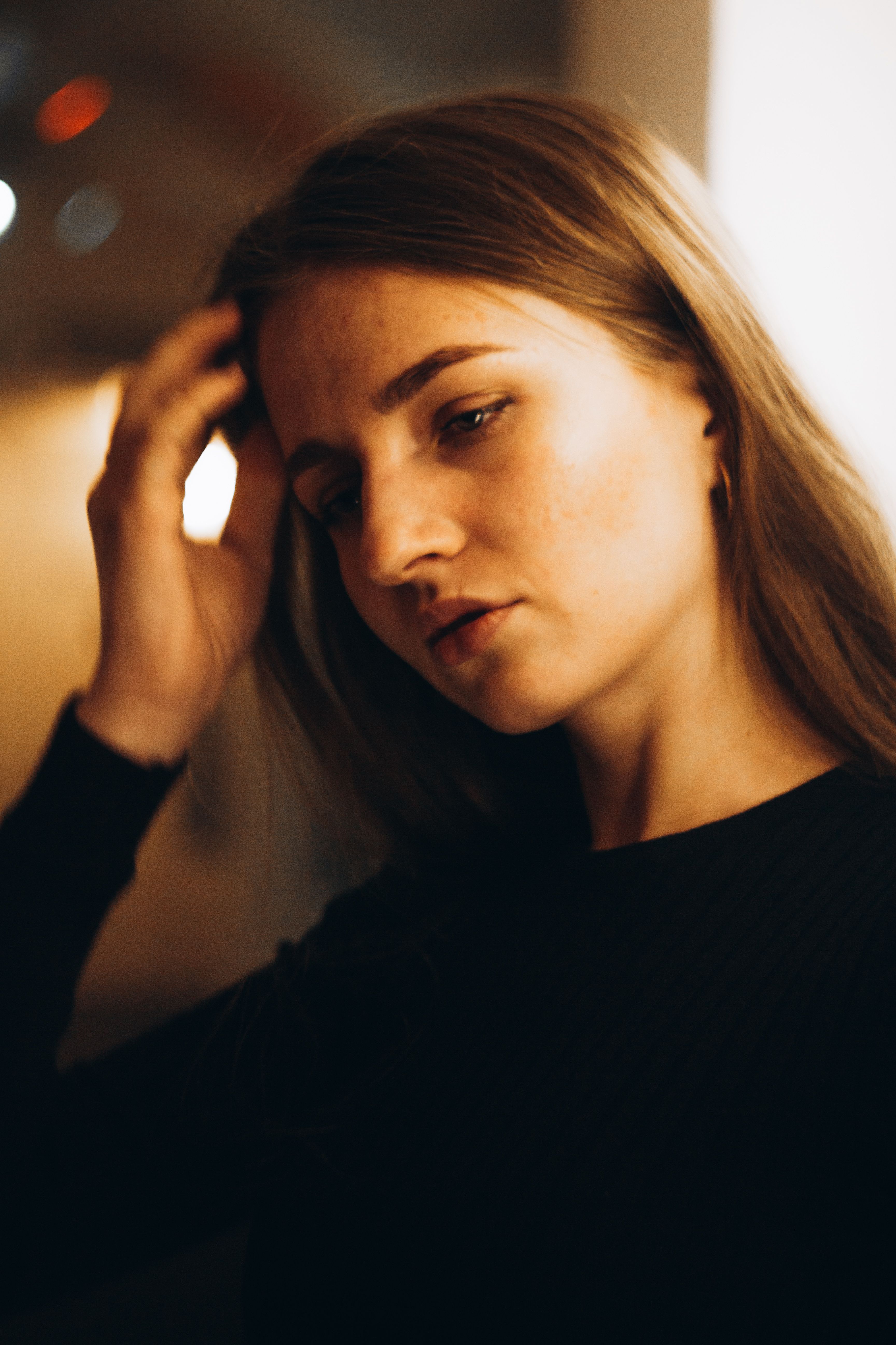 Portrait of a Woman with Her Hand on Her Head · Free Stock Photo