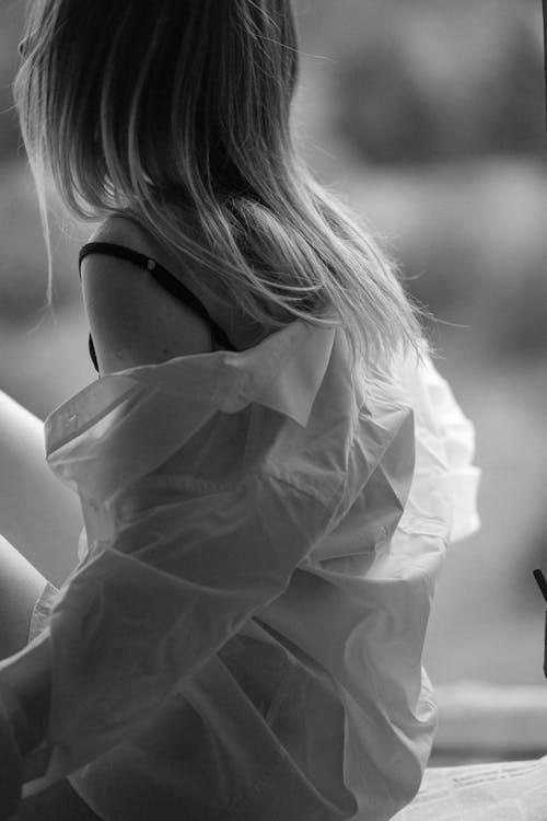 Monochrome Photo of a Woman Wearing a Dress Shirt