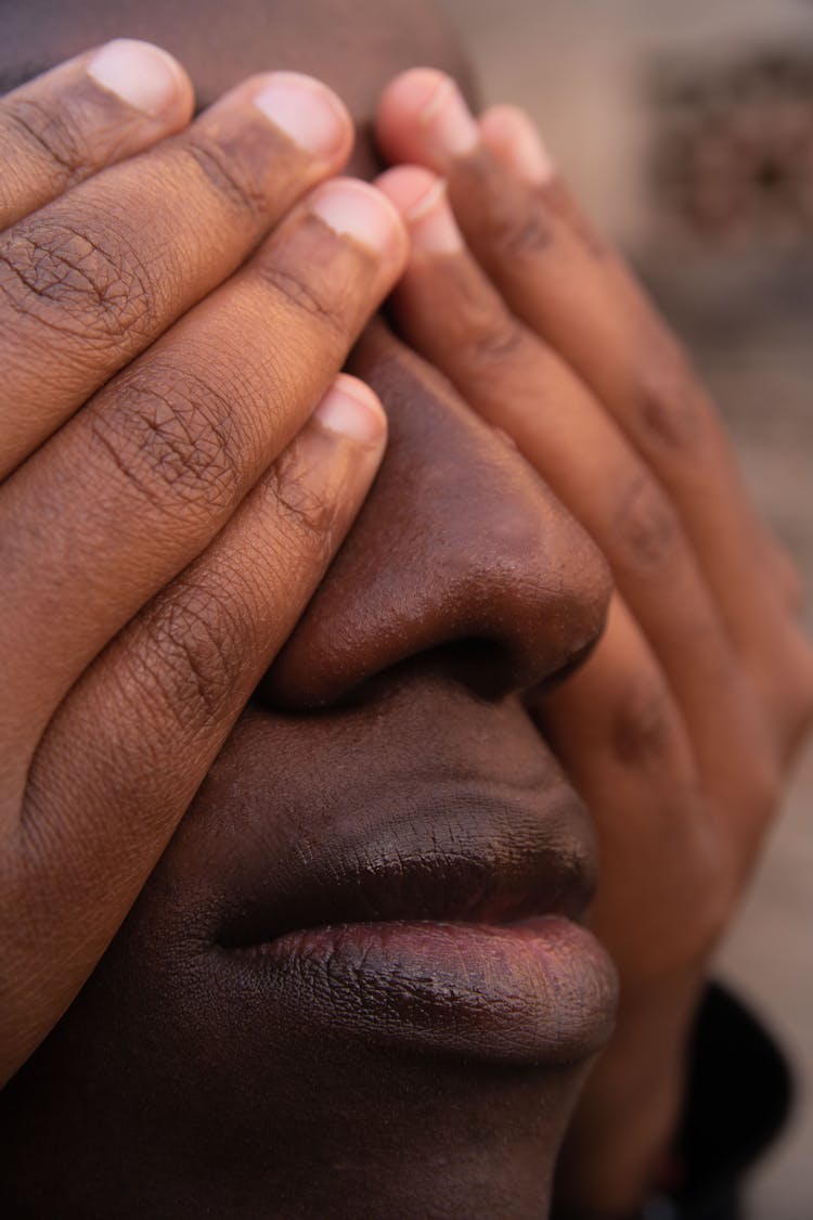 Hands Covering Man Face