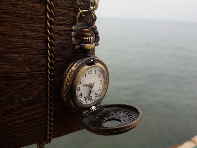 Pocket Watch Hanging From A Wooden Crate