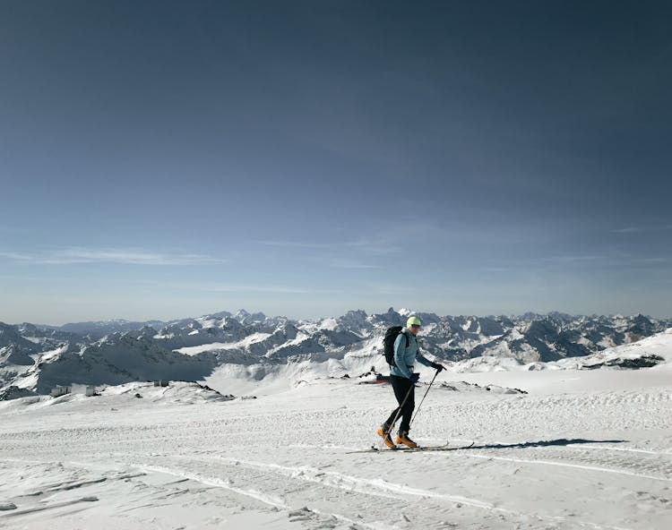 Man Skiing High In Mountains