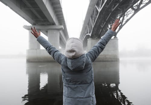 Person Standing Under the Bridge