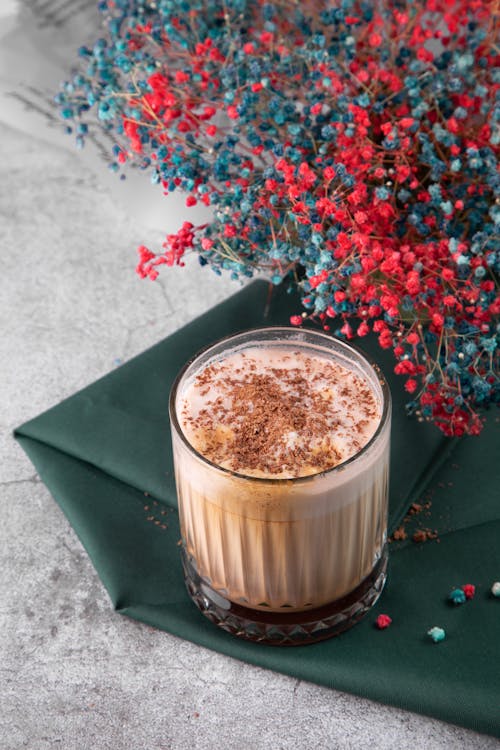 Coffee with Chocolate with Flowers on Table