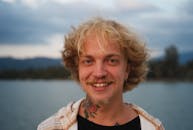 Portrait of a Man Standing by a Lake