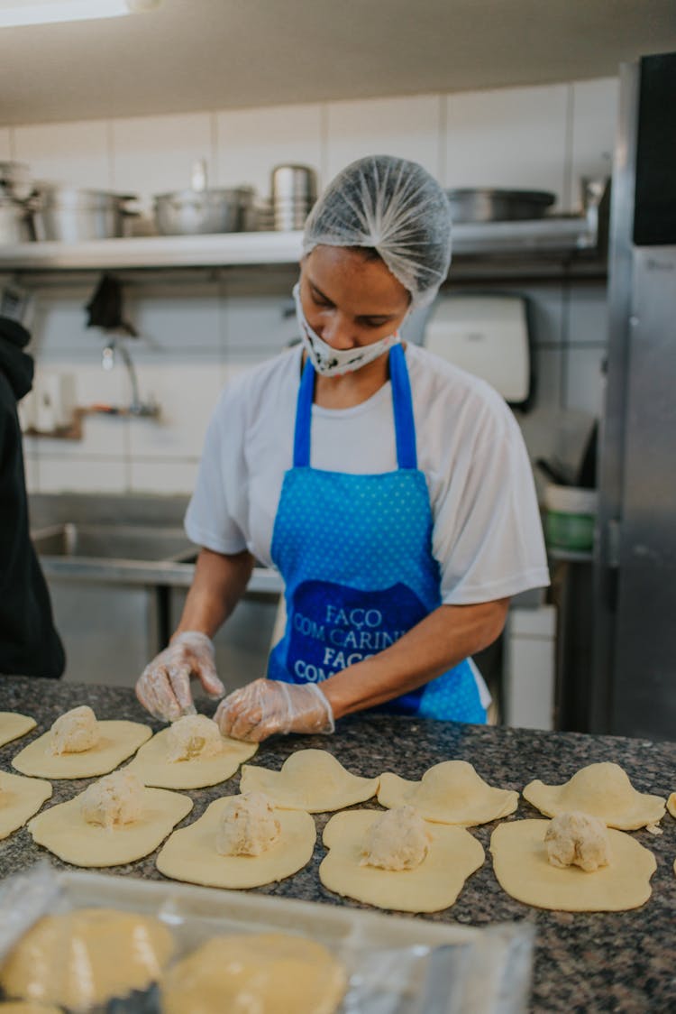 Woman In Apron Baking