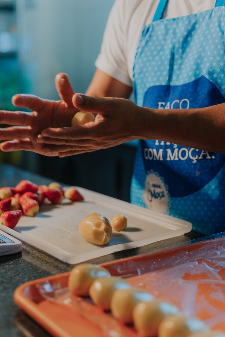 Person Molding A Dough