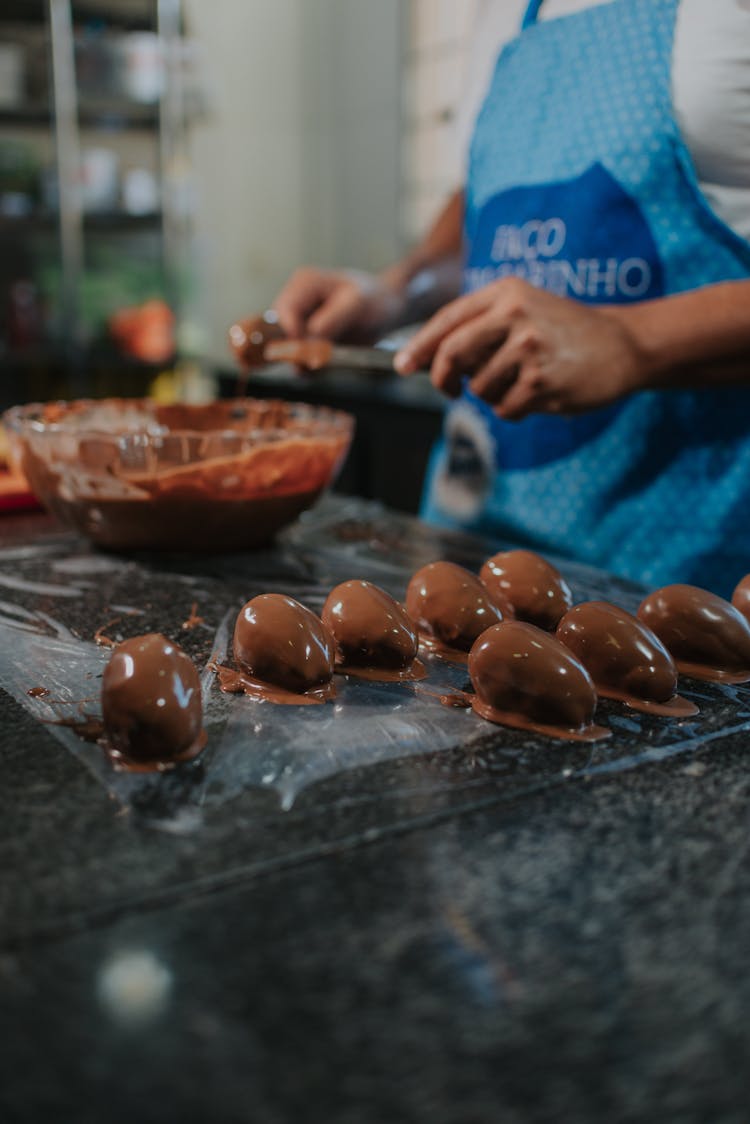 Round Pieces Of Food Covered With Melted Chocolate