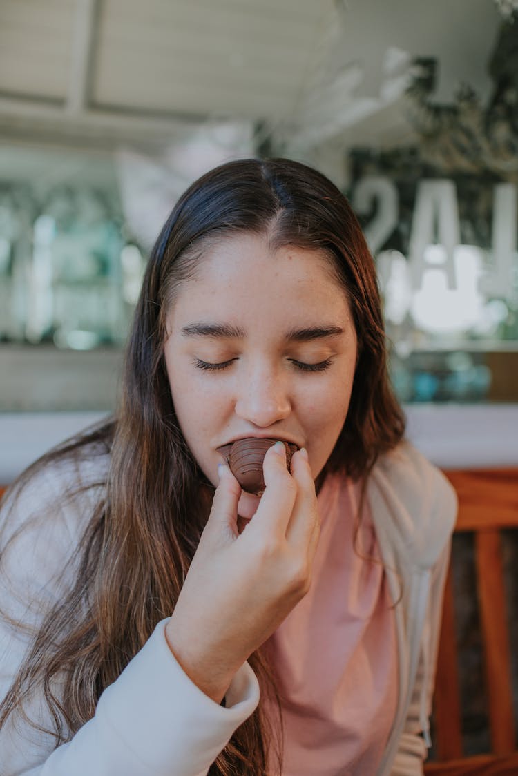 Woman Eating Chocolate