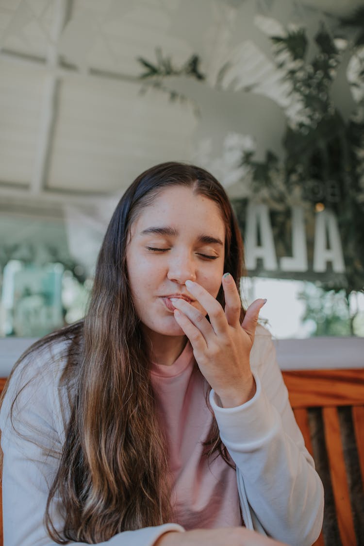 Portrait Of Woman Licking Her Fin