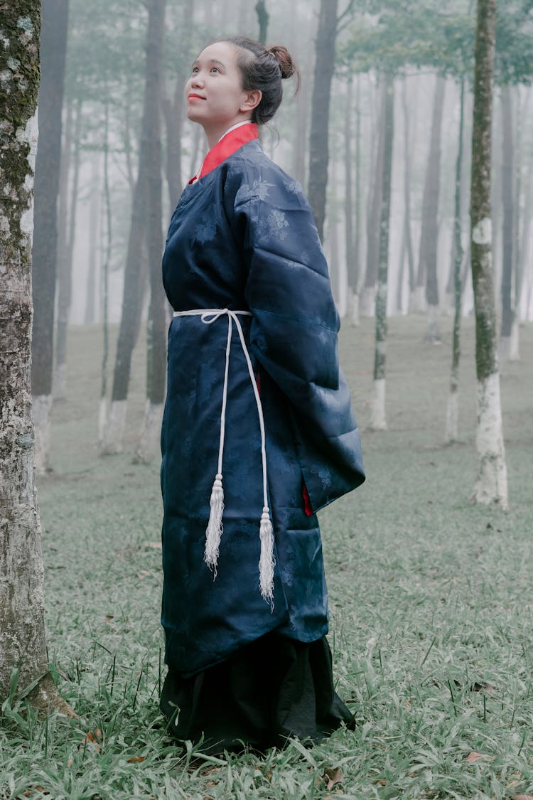 Woman In A Traditional Gown In The Forest 