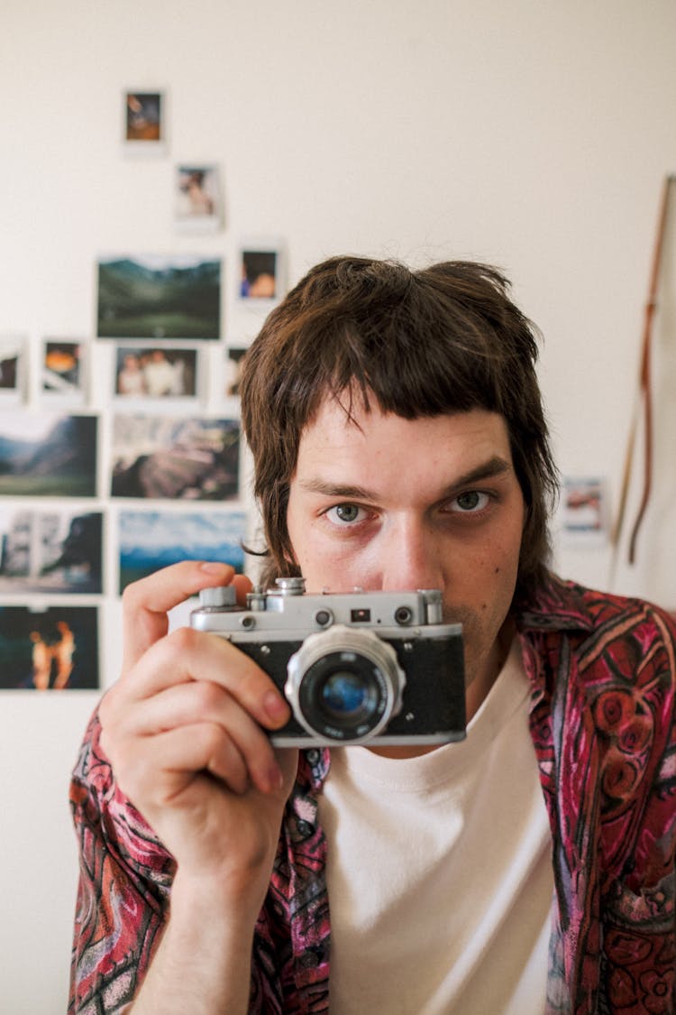 Teenage Photographer Taking Picture With Analog Vintage Camera