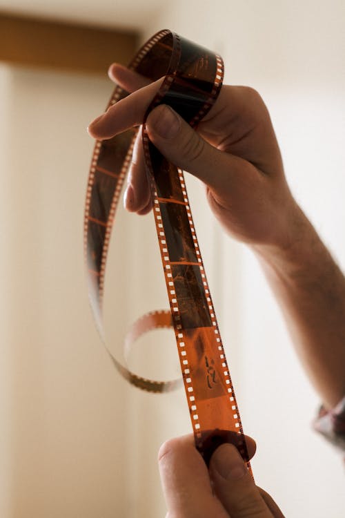 Hands Holding Photographic Film