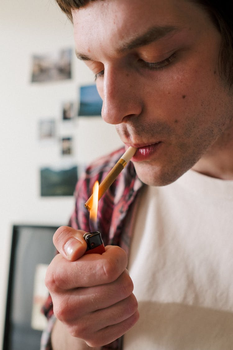 Portrait Of Man Lighting Cigarette