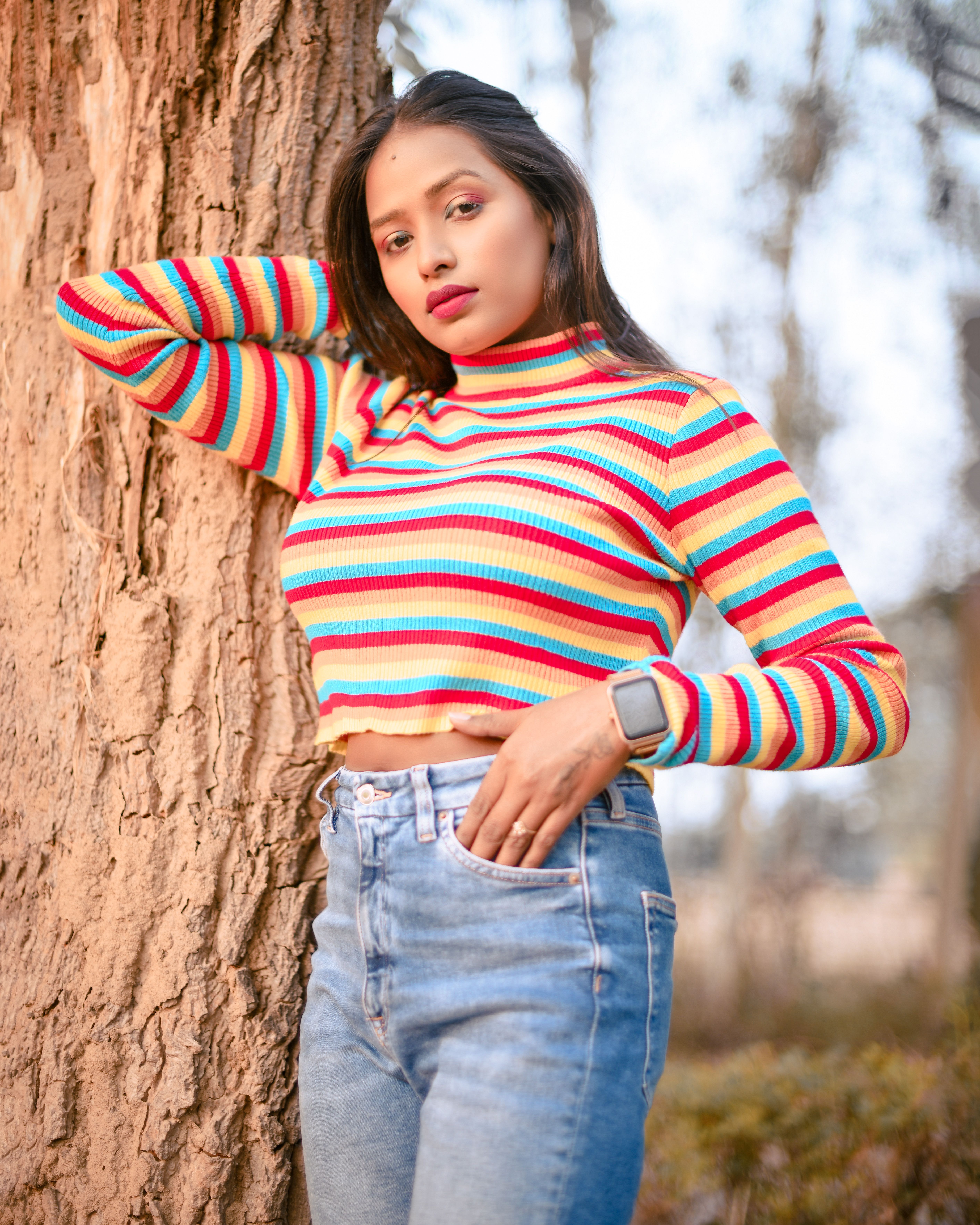 Woman in striped top and red jeans