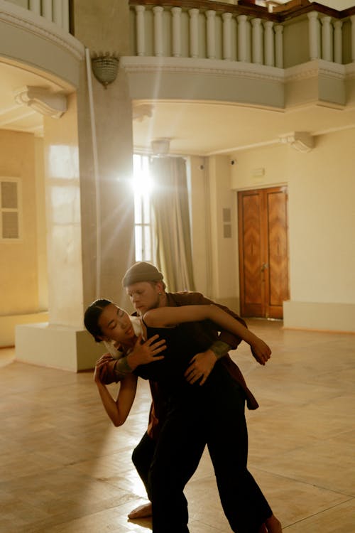 Photo of Man and Woman Dancing