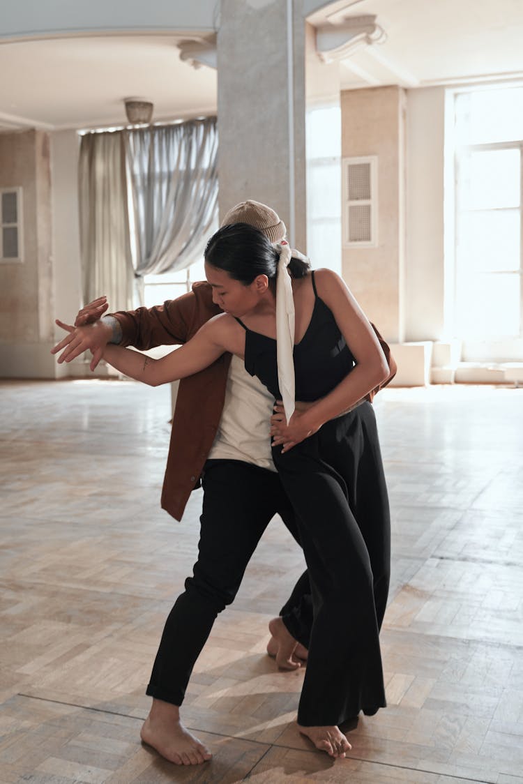 A Man And Woman Dancing Together 