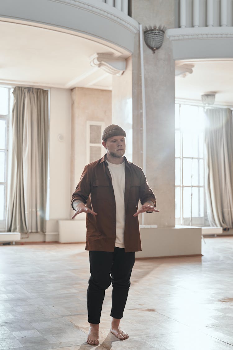 Man Wearing Hat In A Museum 