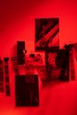 Collection of Pictures and Camera Films Developing in Red Darkroom