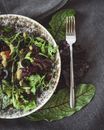 A Fork beside a Plate of Salad