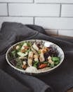 Caesar Salad Presented on Plate on Gray Fabric