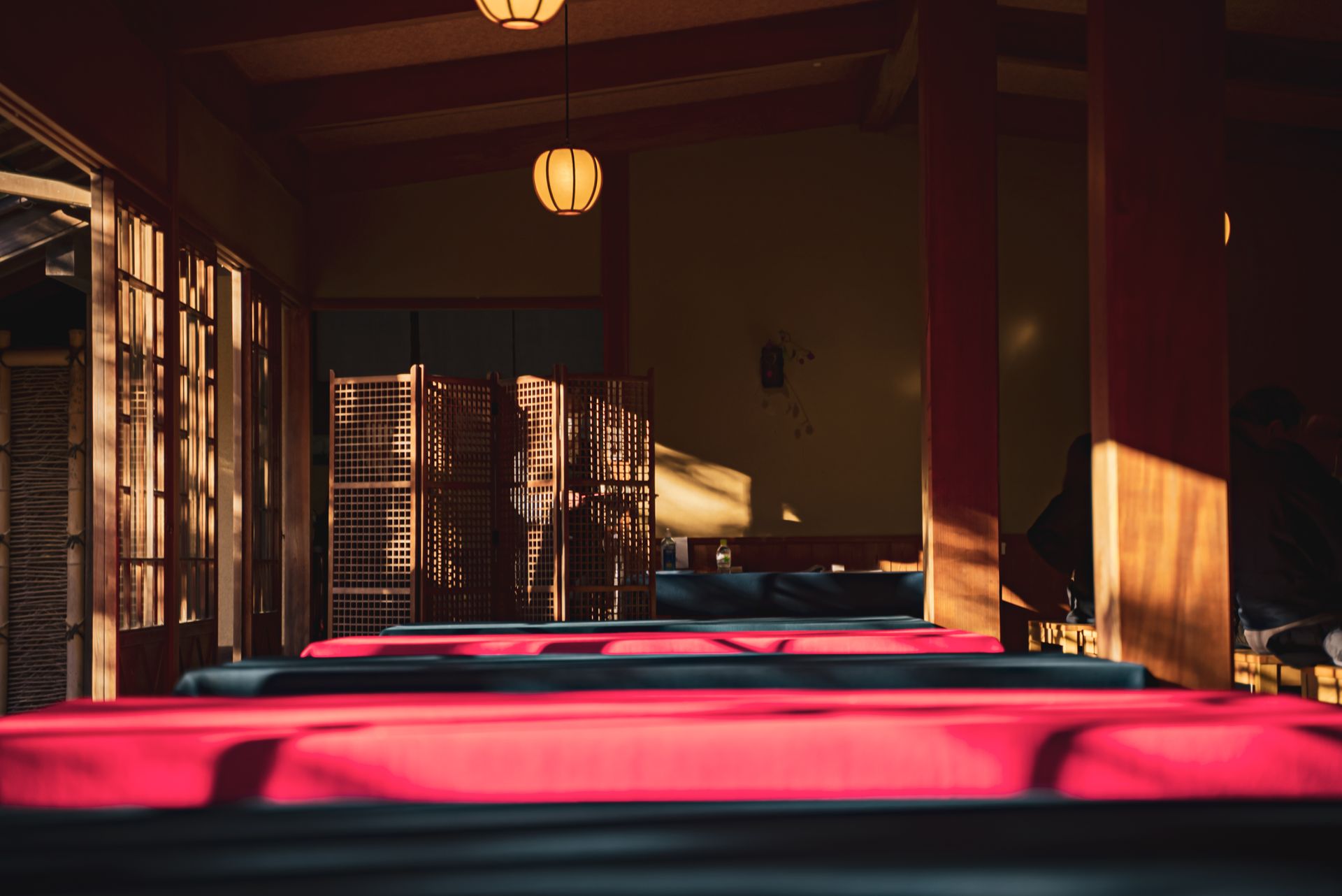Serene traditional Japanese room interior in Kyoto with soft lighting and wooden elements.