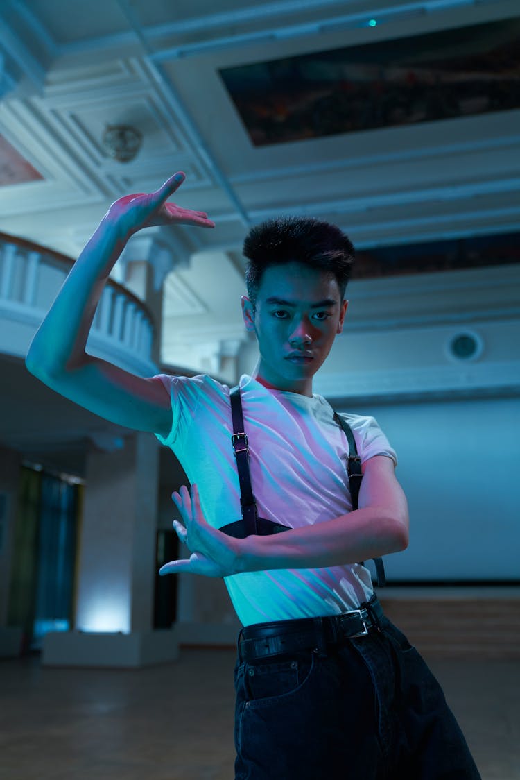 Photograph Of A Man In A White Shirt Dancing