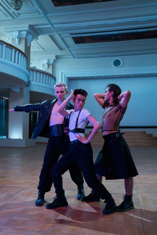 Free Three dancers performing energetically indoors, showcasing diverse styles and dynamic poses. Stock Photo