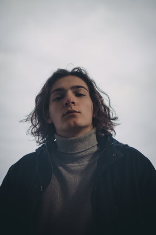 Close-Up Photo of a Man Wearing a Gray Turtleneck