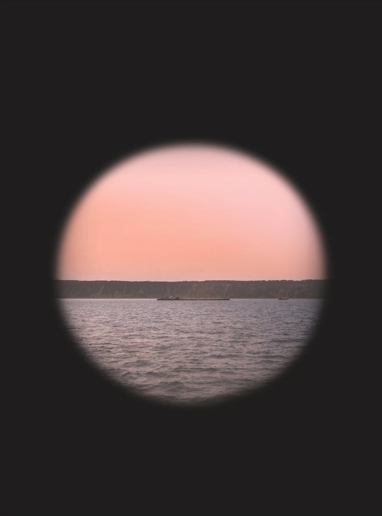 Telescope View Of A Ship On The River 