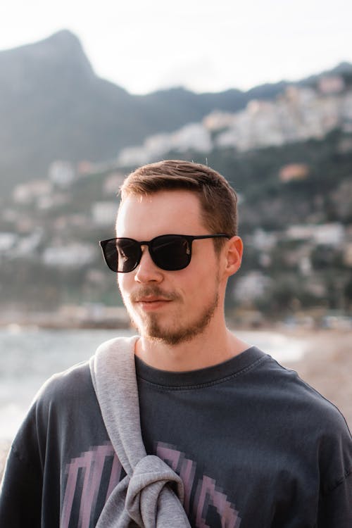 Smiling Man in Sunglasses on Beach