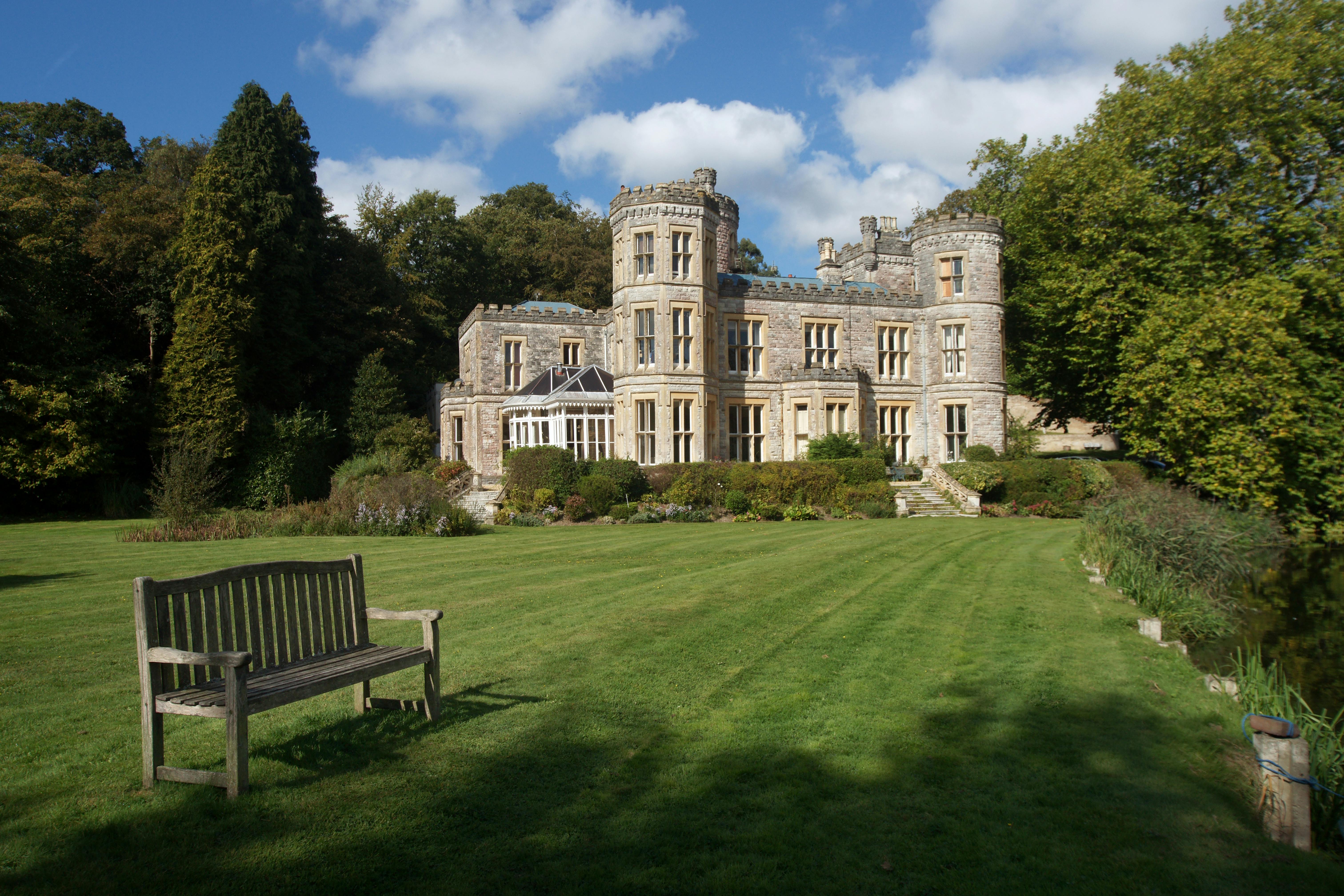Charming English castle surrounded by lush gardens and lawn in Saint Ives, England.