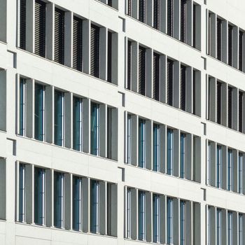 Close-up of a modern building facade with windows in Oslo, showcasing architecture design.
