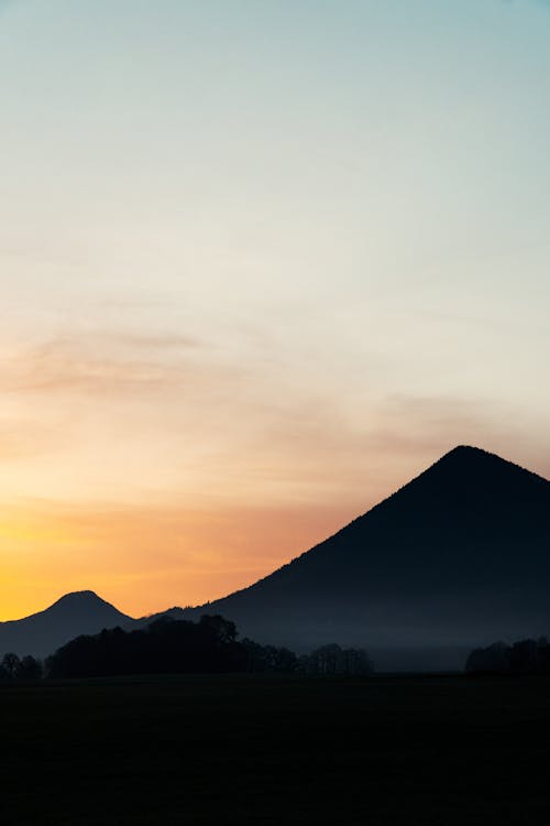 Free Silhouette of a Mountain During Sunset Stock Photo
