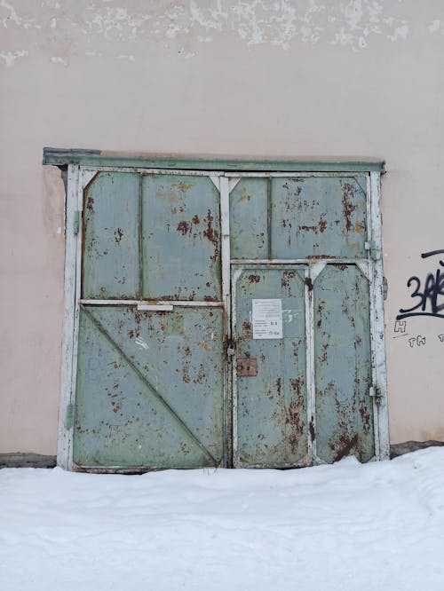 Old Metal Entrance Door to an Industrial Buildling