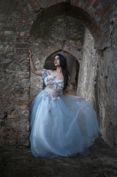 Woman Wearing a Blue Dress Standing on a Tunnel