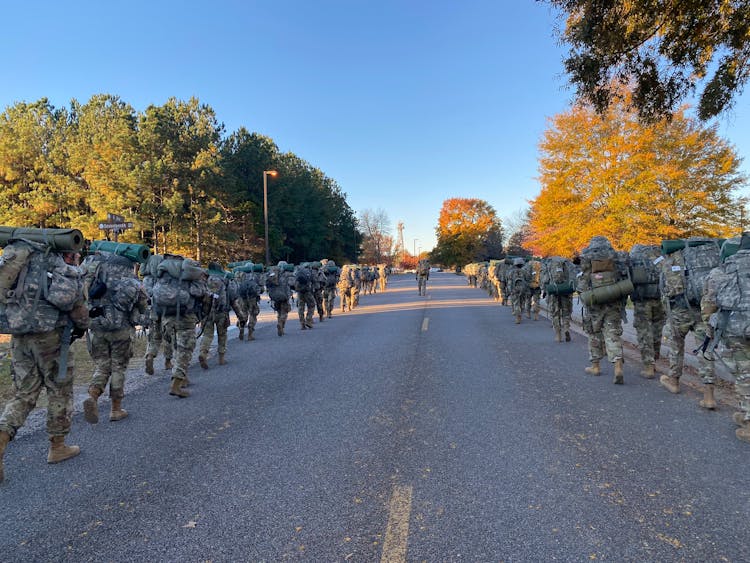 Soldiers Walking On The Road