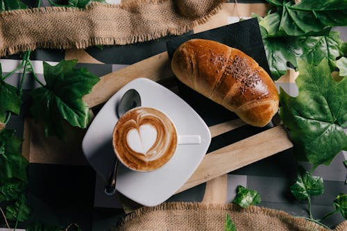 Chocolate Sprinkles on Bread and a Cup of Coffee