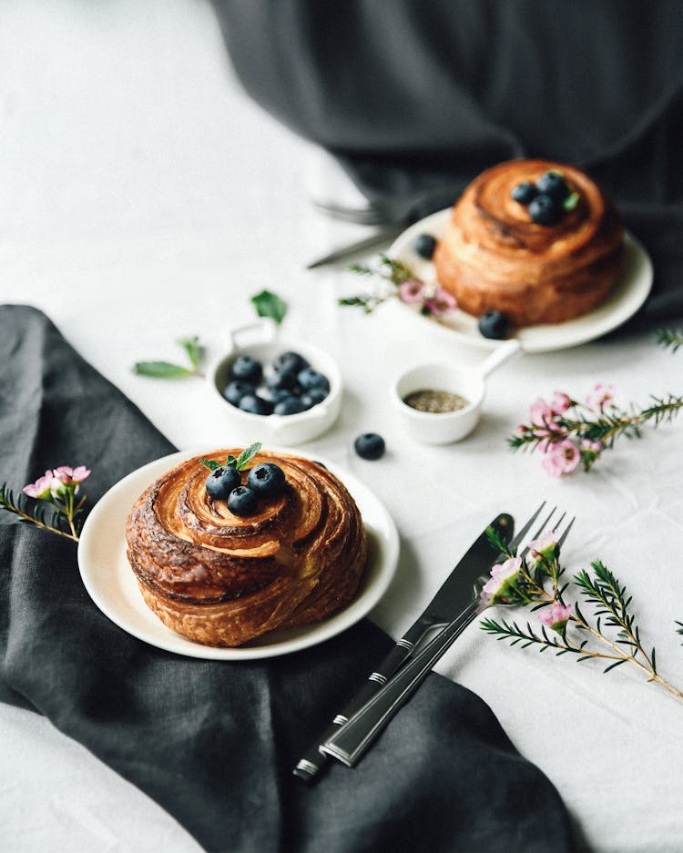 French Pastry With Blueberries Served On Black And White Table Decoration