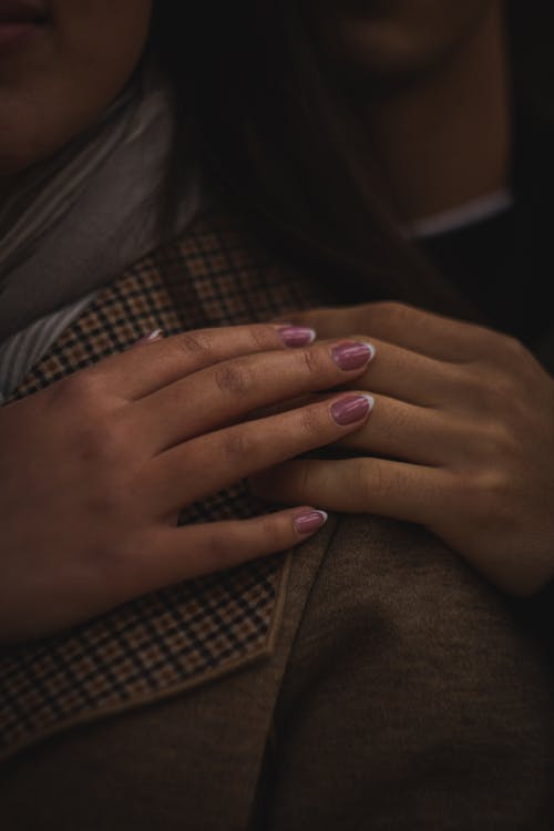 Free A Couple Touching Hands Stock Photo