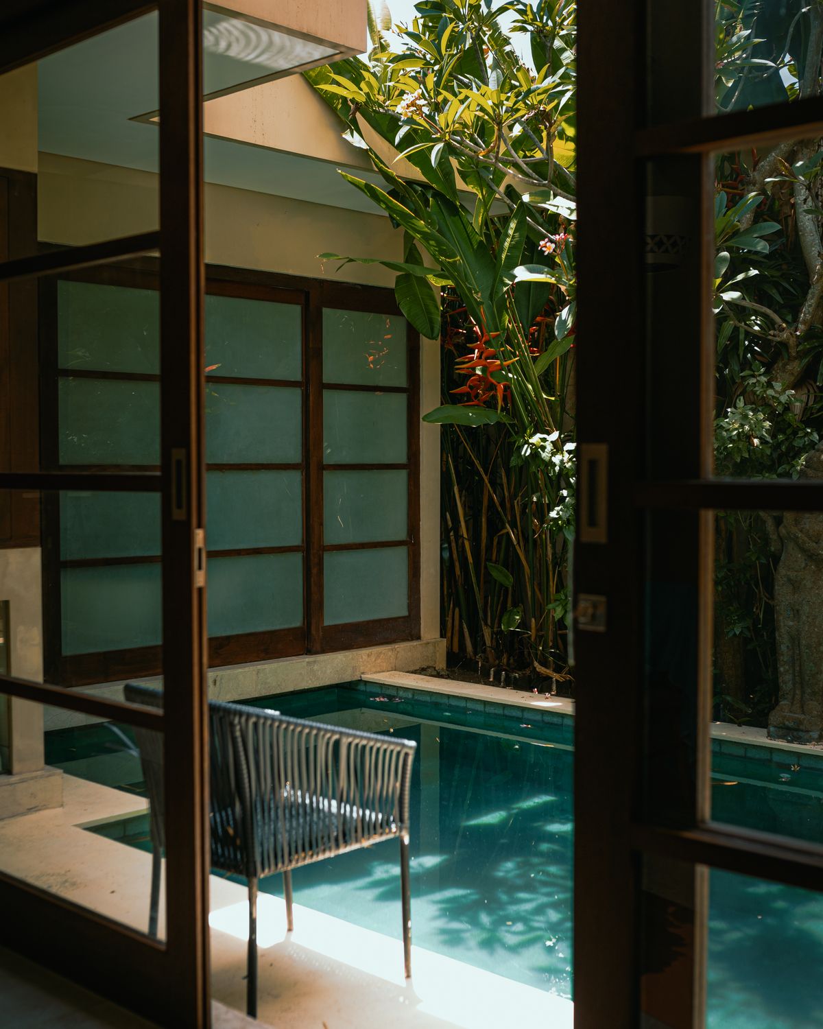Doorway opening towards a swimming pool