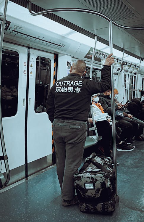 Free A Man Riding a Train Stock Photo