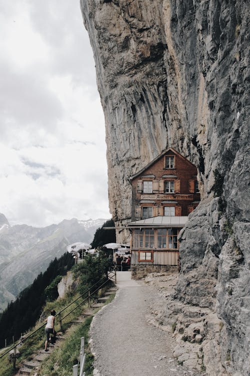 Free Brown Wooden House on Edge of Cliff Stock Photo