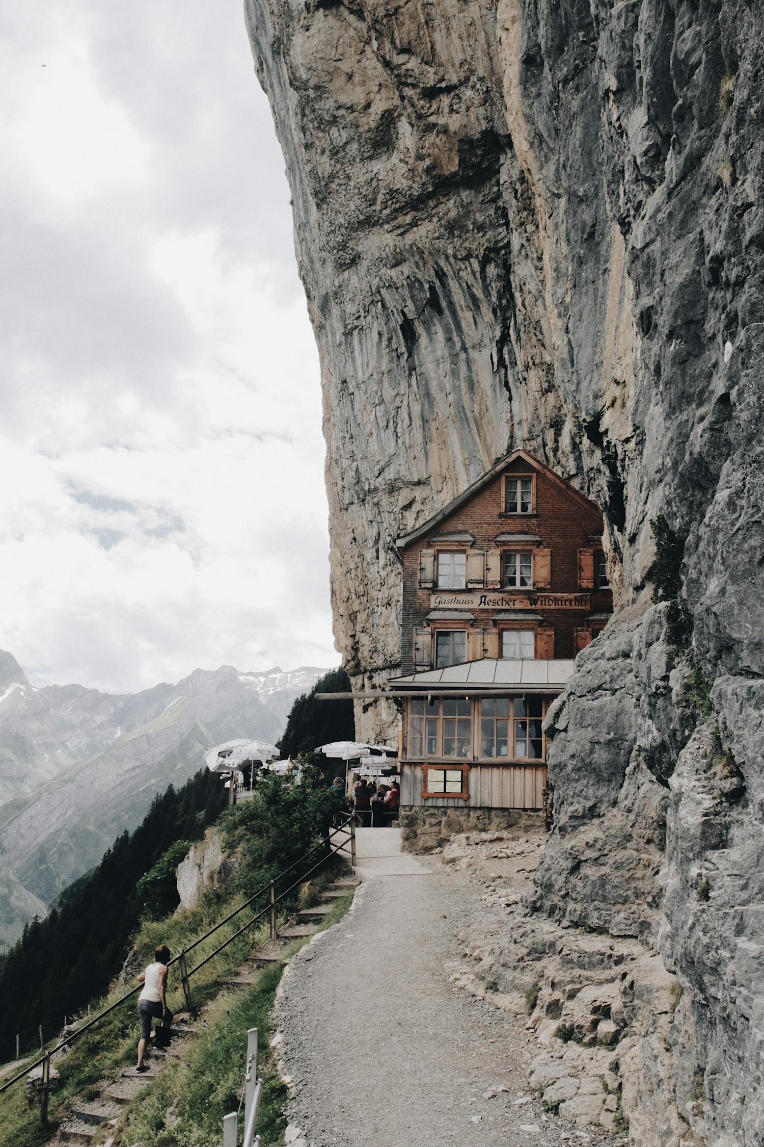 Brown Wooden House on Edge of Cliff
