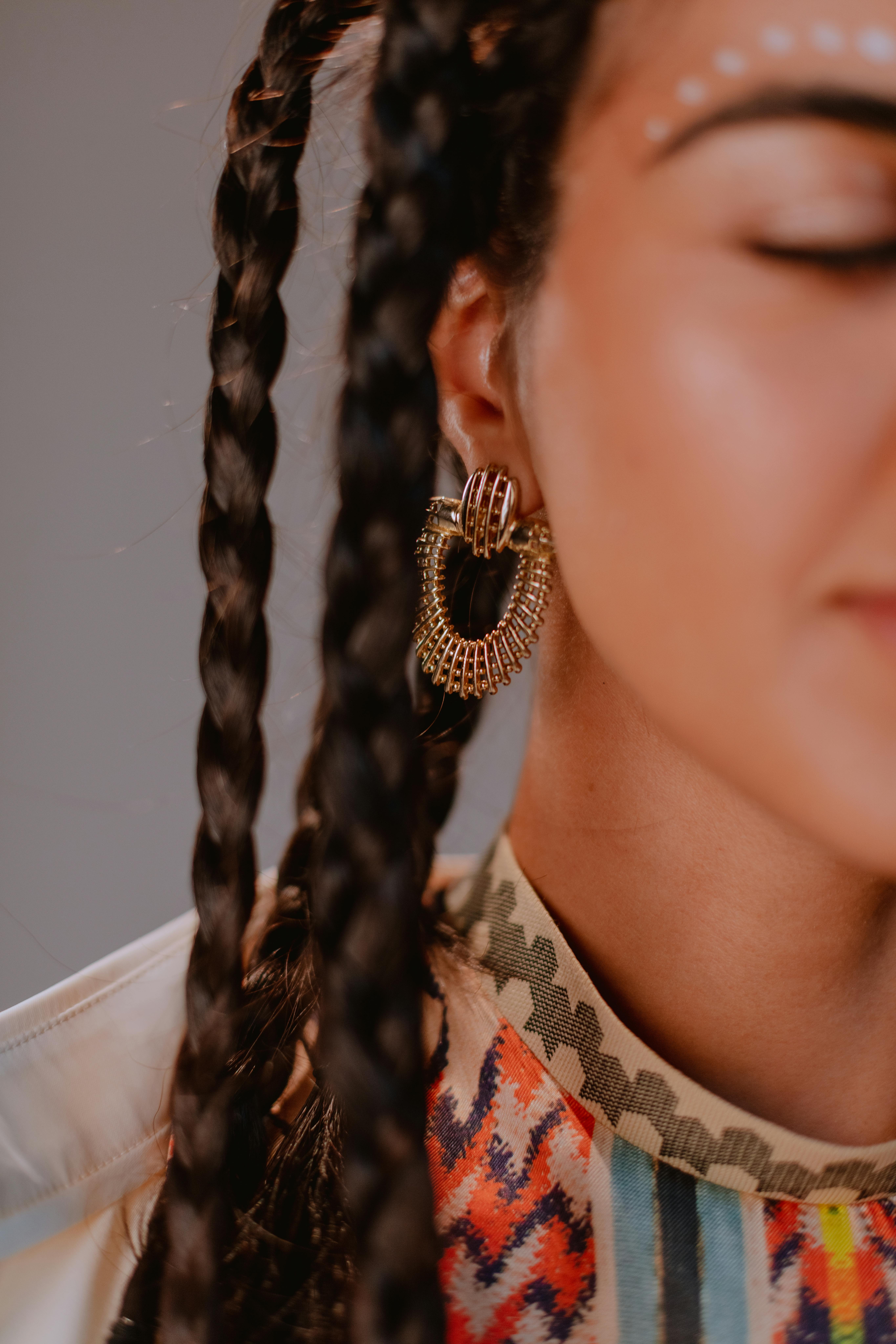 Free Close-up Photo of Woman wearing Gold Earings Stock Photo