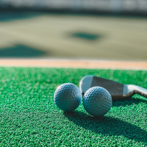 Free Close-Up Shot of Two Golf Balls Stock Photo